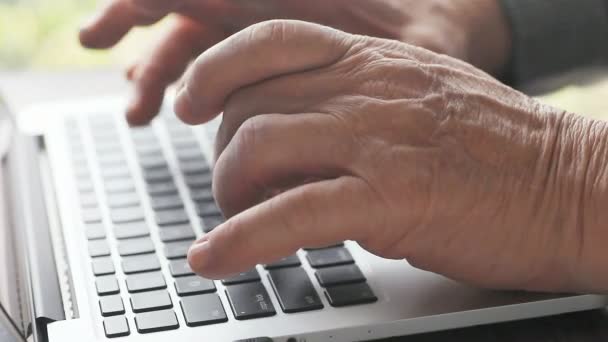 Senior Man Using His Laptop Keyboard — Stock Video