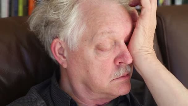 Tired Man Sofa Rubs His Eye — Stock Video