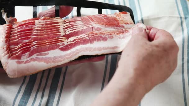 Man Pulls Strip Bacon Package Dish Towel — Stock Video