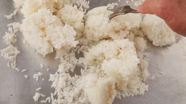 Using Fork Woman Separates Cold Rice Clumps — Stock Video