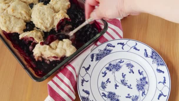 Woman Serves Portion Fresh Blueberry Cobbler Decorative Dish — Stock Video
