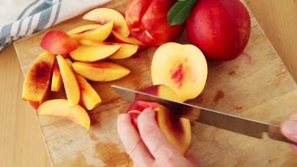 Woman Cuts Fresh Nectarines Cutting Board — Stock Video