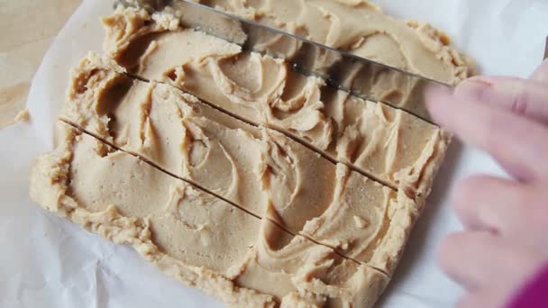 Woman Cuts Block Fudge Parchment Paper — Stock Video