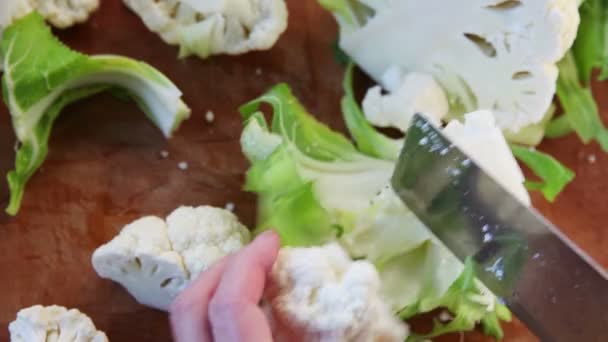 Woman Cuts Cauliflower Smaller Pieces — Stock Video