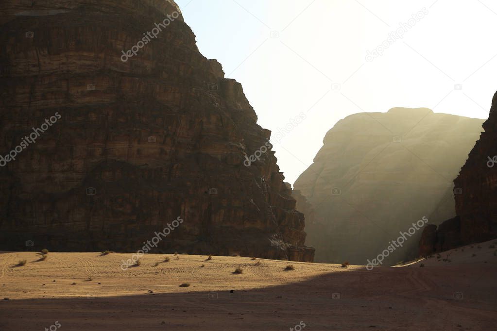 Mountains in Wadi Rum desert in Hashemite Kingdom of Jordan. Amazing scenery of Wadi Rum desert in Jordan, also known as The Valley of Moon, is largest and picturesque desert in Jordan