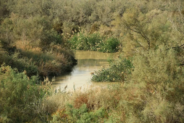 Jordan River in Al-Maghtas - historical place of baptism of Jesus Christ in Jordan, is world heritage site on east bank of Jordan river, officially known as Baptism Site Bethany Beyond the Jorda