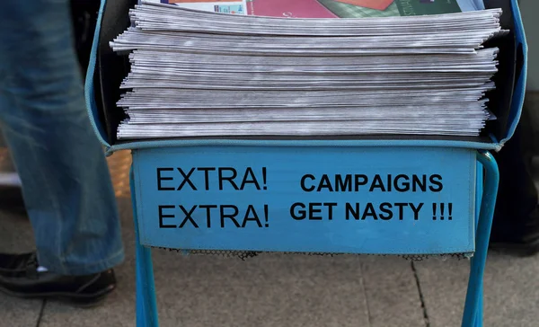 Campaigns get nasty Newspaper stack - take one of these newspaper in the subway entrance.
