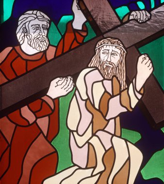 5th Stations of the Cross, Simon of Cyrene carries the cross, stained-glass window in the church of St. John the Baptist in Rijeka, Croatia clipart