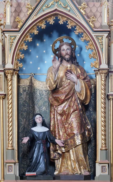 Sacred heart of Jesus statue on the Sacred heart of Jesus altar in the church of Saint Matthew in Stitar, Croatia