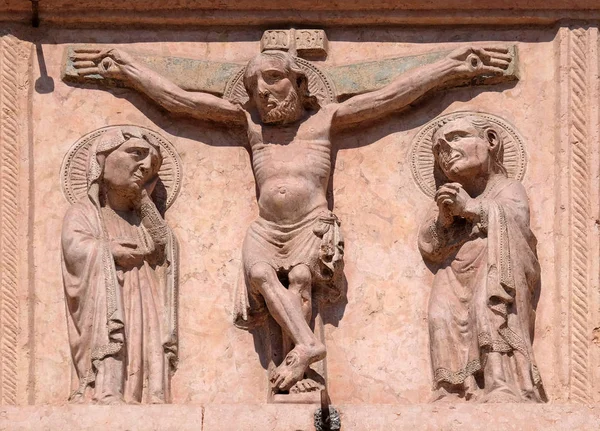 Crucifixion, relief on Facade of Saint Anastasia Church in Verona, Italy