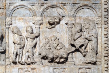Bas-relief of Maestro Nicolo' (12th century), group to the right of the door of the Basilica of St Zeno, UNESCO World Heritage Site, in Verona, Italy clipart