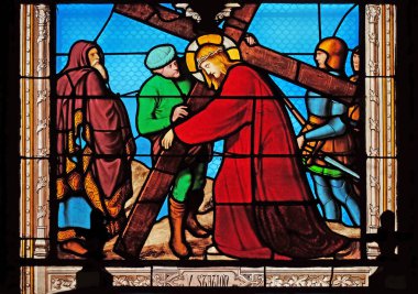 5th Stations of the Cross, Simon of Cyrene carries the cross, stained glass windows in the Saint Eugene - Saint Cecilia Church, Paris, France  clipart