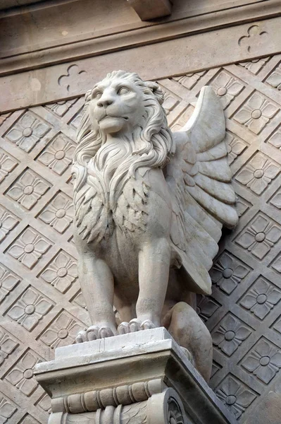 The winged Lion symbol of St. Mark the Evangelist, statue on the facade of Saint Augustine church in Paris, France