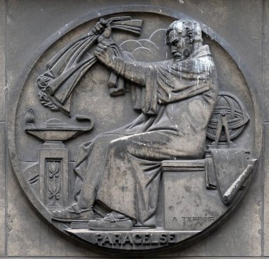 Paracelsus, was a Swiss physician, alchemist and astrologer of the German Renaissance. Stone relief at the building of the Faculte de Medicine Paris, France. clipart