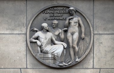 Agnodice, female doctor in front of the Areopagus. Stone relief at the building of the Faculte de Medicine Paris, France. clipart