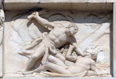 Cain killing Abel, marble relief on the facade of the Milan Cathedral, Duomo di Santa Maria Nascente, Milan, Lombardy, Italy clipart