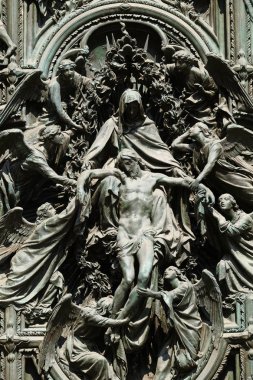 Lamentation of Christ, detail of the main bronze door of the Milan Cathedral, Duomo di Santa Maria Nascente, Milan, Lombardy, Italy clipart