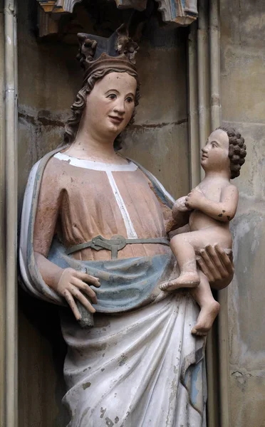 Virgin Mary with baby Jesus, statue on the tabernacle in St James Church in Rothenburg ob der Tauber, Germany