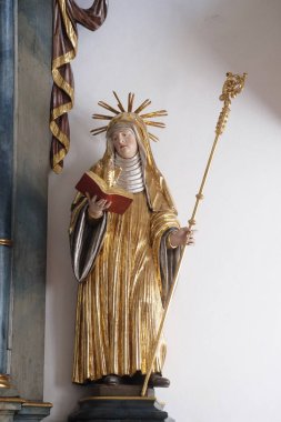 Saint Scholastica, Schmerlenbach'taki St. Agatha kilisesinde sunak heykeli, Almanya