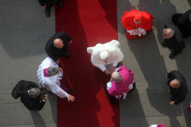 Canons of Zagreb greet Pope Benedict at the entrance to the Zagreb Cathedral clipart