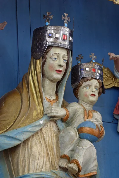 Virgin Mary with the baby Jesus statue on the high altar in the parish church of Our Lady of Miracles church in Ostarije, Croatia