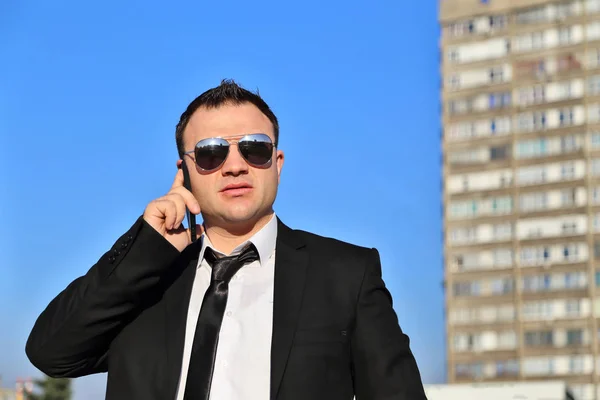 Businessman Using Mobile Phone Outdoors