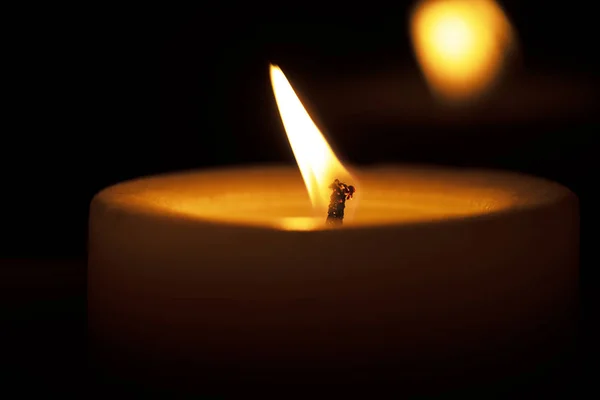 Candle burns on a window sill — Stock Photo, Image