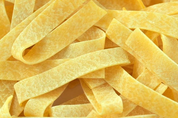 Raw wheat pasta close up — Stock Photo, Image