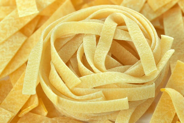 Raw wheat pasta close up