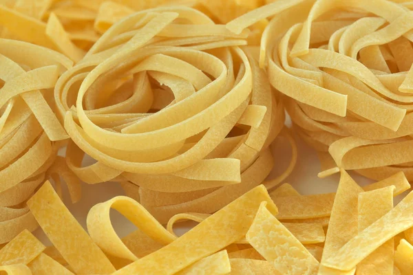 Raw wheat pasta close up — Stock Photo, Image