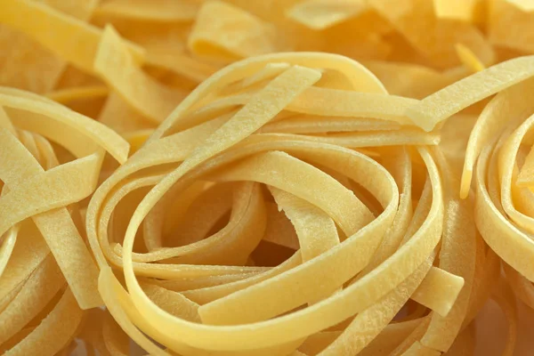 Raw wheat pasta close up — Stock Photo, Image