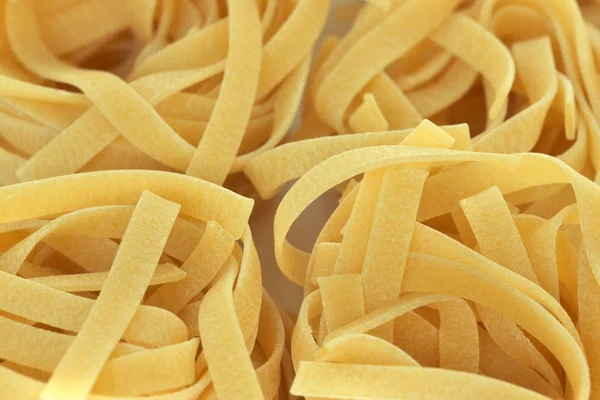 Raw wheat pasta close up — Stock Photo, Image