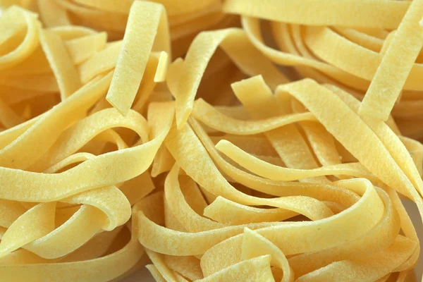 Raw wheat pasta close up — Stock Photo, Image