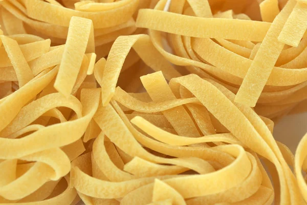 Raw wheat pasta close up — Stock Photo, Image