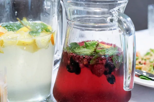 Glass jars with homemade drinks — Stock Photo, Image