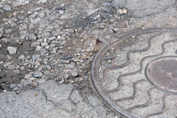 Metal cover of the city sewer — Stock Photo, Image