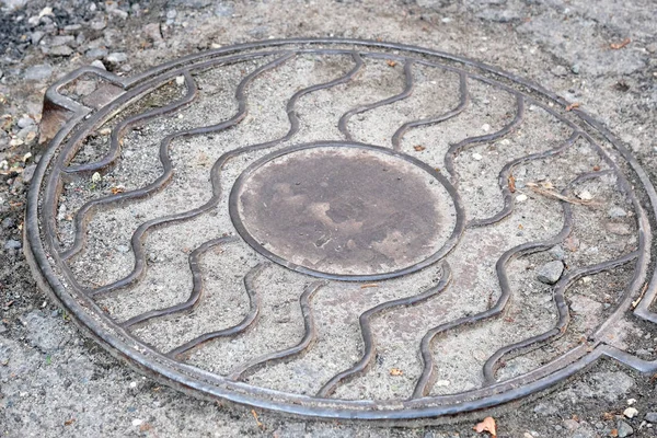 Metal cover of the city sewer