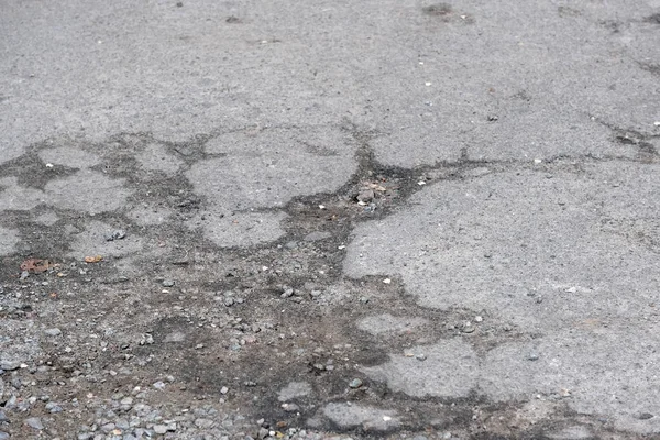 Pavimento de asfalto destruido —  Fotos de Stock