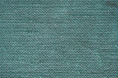 Zarar ve kirli makro fotoğrafçılık izleri olan eski bir kitabın yeşil desenli arka plan ciltleri