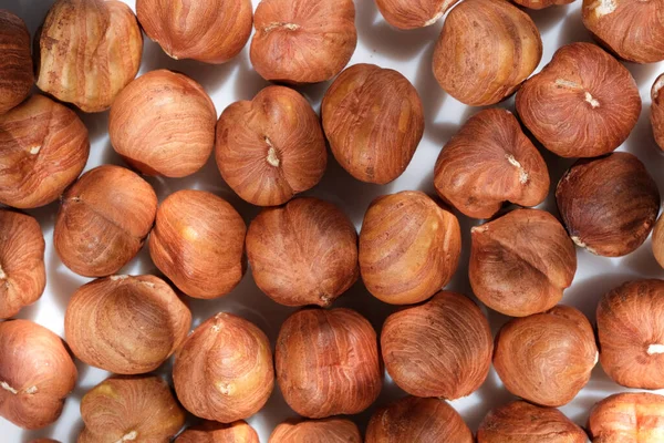 Dried hazelnuts close up macro photography food vegetarian background