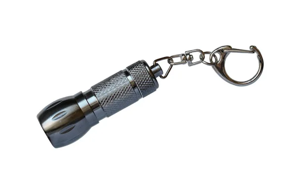 Small metal flashlight charm — Stock Photo, Image