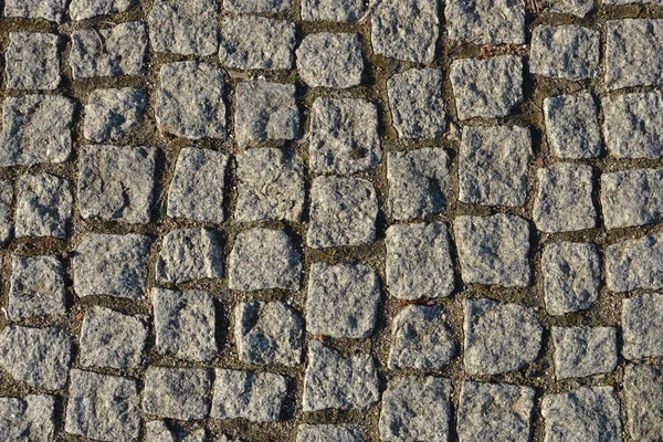 Altes Kopfsteinpflaster in Nahaufnahme. — Stockfoto