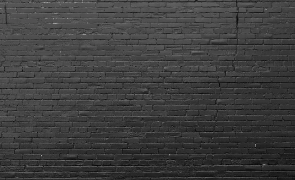 Кирпичная стена окрашена тёмно-синей краской . — стоковое фото