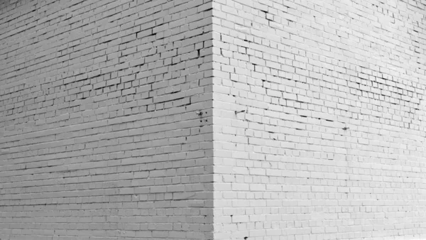 Mur en brique peint avec de la peinture blanche. — Photo