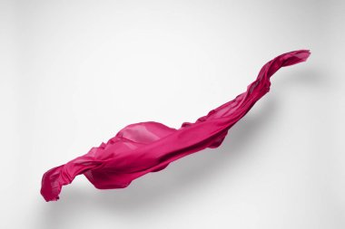 Soyut kırmızı kumaş parçası uçan, yüksek hızlı stüdyo çekimi