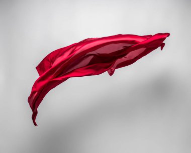 Soyut kırmızı kumaş parçası uçan, yüksek hızlı stüdyo çekimi