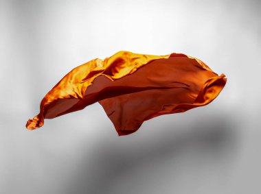 Soyut uçan, yüksek hızlı stüdyo çekim turuncu kumaş parçası