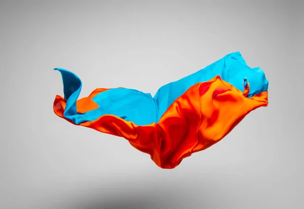 abstract pieces of multicolored fabric flying, high-speed studio shot