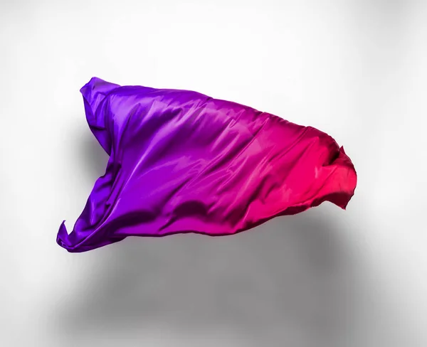 abstract pieces of multicolored fabric flying, high-speed studio shot