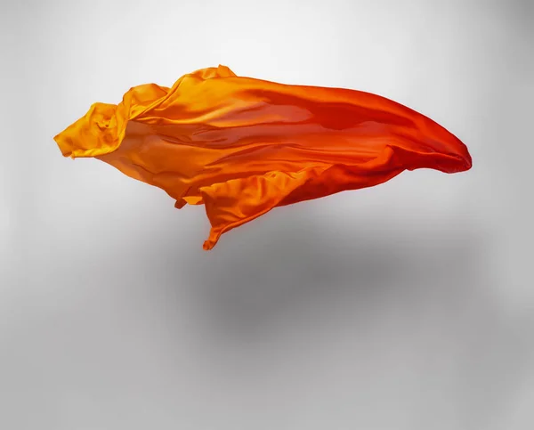 Abstraktní Kus Látky Oranžové Létání Vysokorychlostní Studio Shot — Stock fotografie
